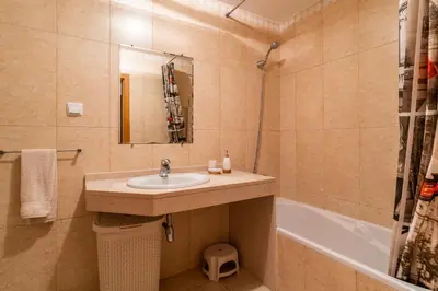 a bathroom with a sink and a bath tub at Garajau View Apartment by Holiday Rental Madeira in Caniço