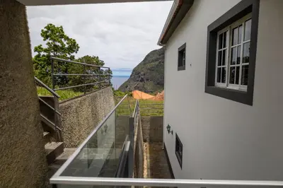 a view from the window of a house at Holiday home with game room and entertainment in São Vicente