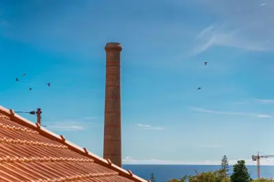 a brick chimney on the roof of a house at GuestReady – Quaint Retreat in Funchal in Funchal