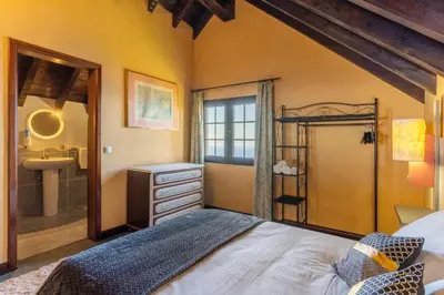 a room with a climbing wall and a couch at Sunset Village by Holiday Rental Madeira in São Jorge
