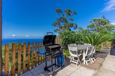 a bedroom with a large bed in a room at Sunset Village by Holiday Rental Madeira in São Jorge