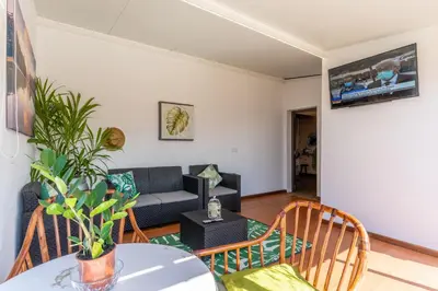 a pink house with a gazebo at Sunset Village by Holiday Rental Madeira in São Jorge