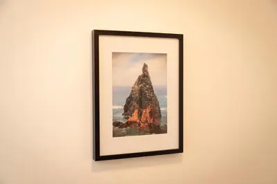 a picture of a rock on a wall at Villa Rita in Machico in Machico