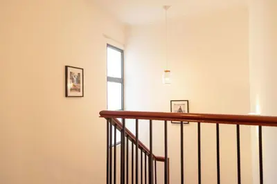 a staircase in a house with a window at Villa Rita in Machico in Machico