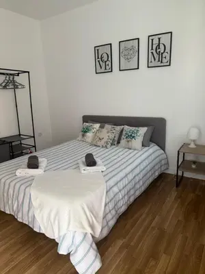 a bedroom with a bed with two towels on it at Sao Lourenco in Caniçal