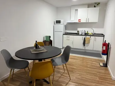 a kitchen and dining room with a table and chairs at Sao Lourenco in Caniçal