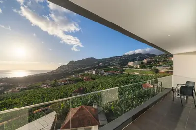 a view of the ocean from the balcony of a house at Saraiva Hills I by An Island Apart in Câmara de Lobos
