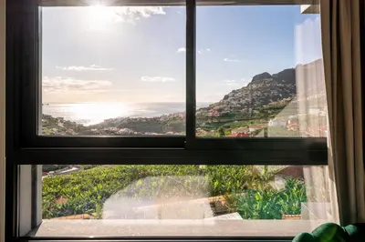 a window with a view of the ocean at Saraiva Hills I by An Island Apart in Câmara de Lobos