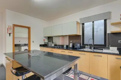 a kitchen with a large counter top in a room at Countryside Charm House by Holiday Rental Madeira in Câmara de Lobos