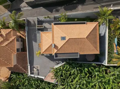 an overhead view of a house with orange roof at Countryside Charm House by Holiday Rental Madeira in Câmara de Lobos