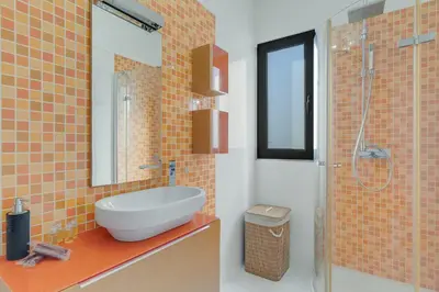 a bathroom with a sink and a shower at Countryside Charm House by Holiday Rental Madeira in Câmara de Lobos