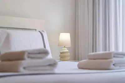 a bedroom with a bed with a lamp on it at villa vista do vale in São Vicente