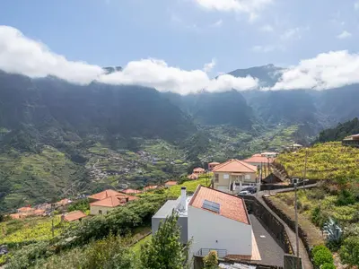 a view of a village in the mountains at villa vista do vale in São Vicente