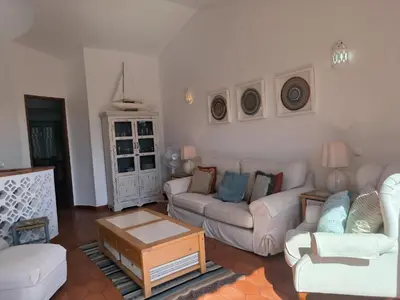 a living room with two couches and a coffee table at Luz Bay Club 29 in Luz