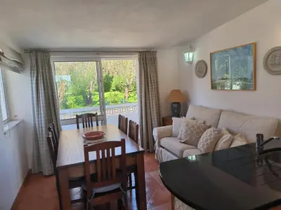 a living room with a couch and a table at Luz Bay Club 29 in Luz