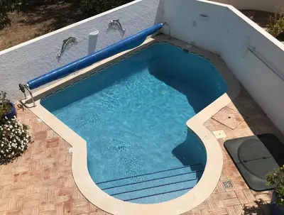 an overhead view of a swimming pool on a house at Luz Bay Club 29 in Luz
