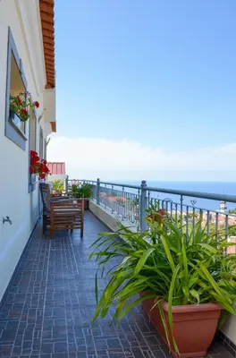a balcony with a view of the ocean at Teixeira House in Arco da Calheta