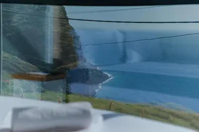 a view of the ocean from a train window at GuestReady - Madeiran oasis with ocean view in Campanário