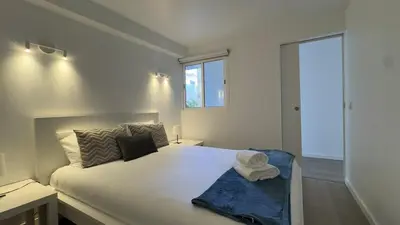 a bedroom with a bed with a towel on it at Like Home IV - Ideal for families and friends in Funchal