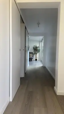 an empty hallway with white walls and wood floors at Like Home IV - Ideal for families and friends in Funchal
