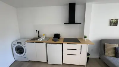 a kitchen with a sink and a washing machine at Like Home IV - Ideal for families and friends in Funchal
