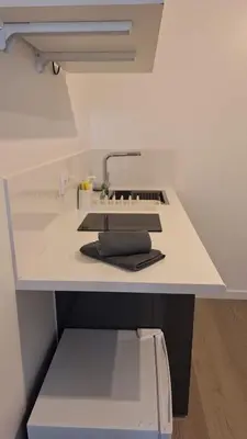 a white counter top with a sink in a room at Like Home V - single room in Funchal
