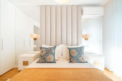 a bedroom with a large bed with two pillows at Suite 5P Madeira Acqua Residence in Funchal