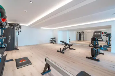a gym with several treadmills and exercise bikes at Suite 5P Madeira Acqua Residence in Funchal