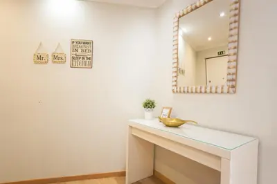 a bathroom with a sink and a mirror at Tropical Sun by Atlantic Holiday in Funchal