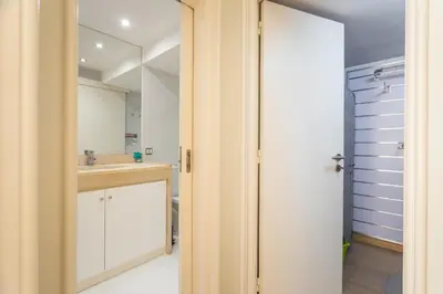 a bathroom with a sink and a mirror at Tropical Sun by Atlantic Holiday in Funchal