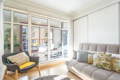 a living room with a couch and a chair at Tropical Sun by Atlantic Holiday in Funchal
