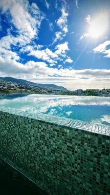a view of the ocean from a building at Casa de Viriato in Funchal