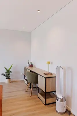 an office with a desk with a speaker in a room at Casa de Viriato in Funchal