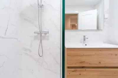 a bathroom with a shower and a sink at GuestReady - Charming home in Câmara de Lobos in Câmara de Lobos