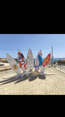 a group of sail boats sitting on the beach at Stay&Relax Sagres - 3min Praia da Mareta in Sagres
