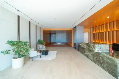 a lobby of a building with a table and chairs at Savoy Monumentalis your home in Madeira Island in Funchal