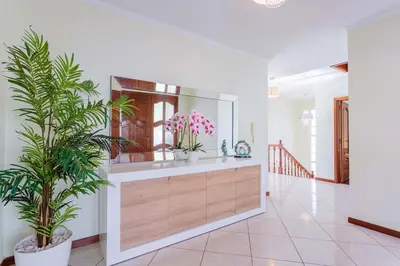 a bathroom with a mirror and plants in a room at Casa Terra da Vinha in Canhas