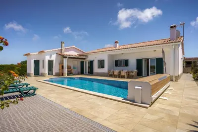 a villa with a swimming pool and a house at Sunny Ocean Villa with pool near Arrifana beach in Aljezur