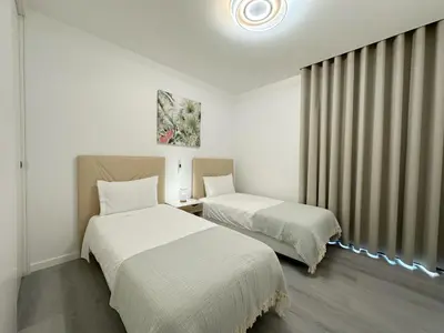 a room with two beds and a window at City Center House in Funchal