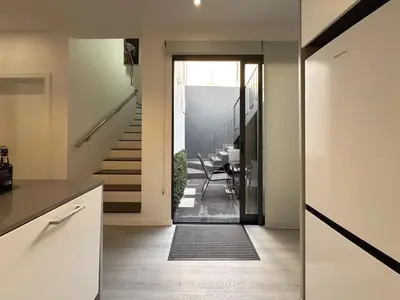 a hallway of a house with a dining room at City Center House in Funchal
