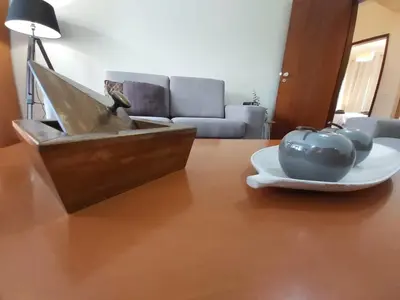a wooden table with a plate of fruit on a table at Jose's Place Holiday Apartment in Funchal