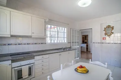 a dining room with a table and chairs at Casa Bom Sucesso in Funchal