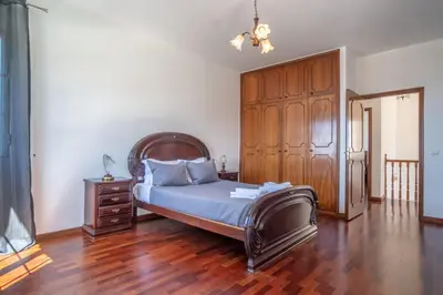 a bedroom with a bed with towels on it at Casa Bom Sucesso in Funchal