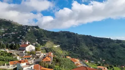 a view of a town on a mountain at Casa Morena - Private Tropical Oasis in Campanário