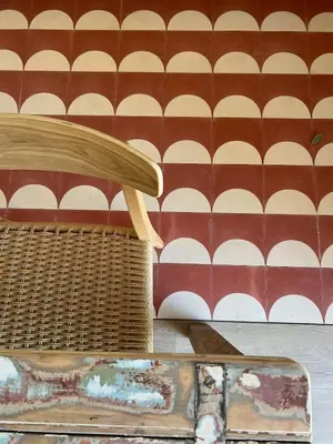 a wicker basket sitting on the floor next to a wall at THE BOAT HOUSE Sea Front and Private Pool in Funchal