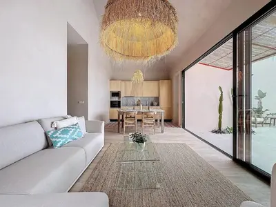 a living room with a couch and a table at THE BOAT HOUSE Sea Front and Private Pool in Funchal