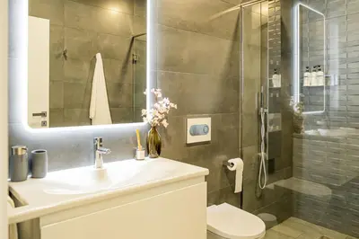 a bathroom with a sink and a shower at Casa da Lombada in Ponta do Sol