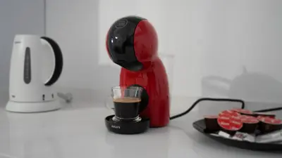 a red mixer on a counter with a cup of coffee at Amaro Oasis by LovelyStay in Funchal