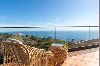a balcony with a view of the ocean at Radiantescapadela in Estreito da Calheta