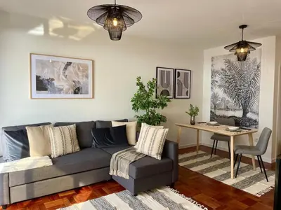 a living room with a couch and a table at Island Time Studio with Sea View in Funchal